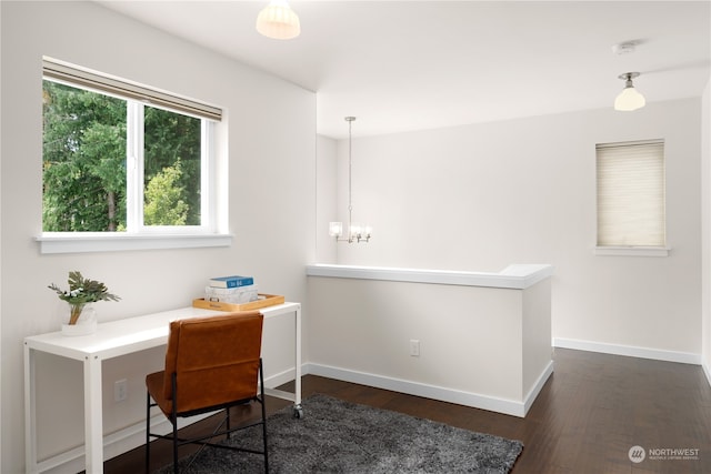 office featuring dark wood-type flooring and a notable chandelier