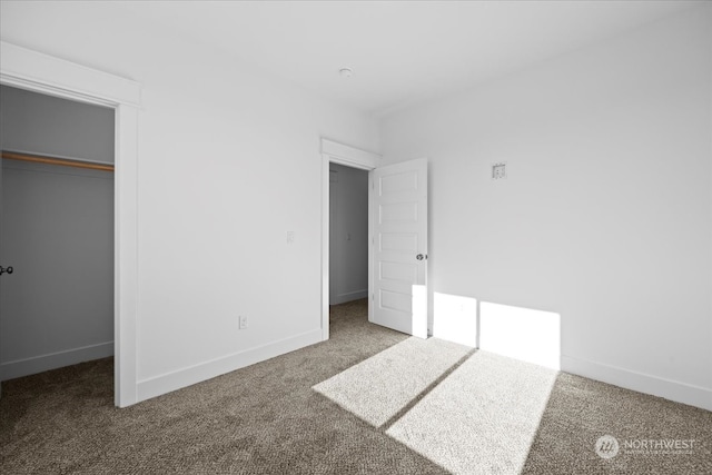 unfurnished bedroom with carpet and a closet