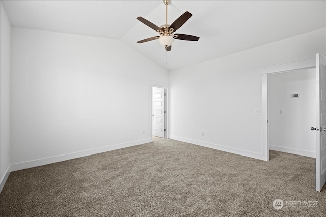 spare room featuring lofted ceiling, carpet flooring, and ceiling fan