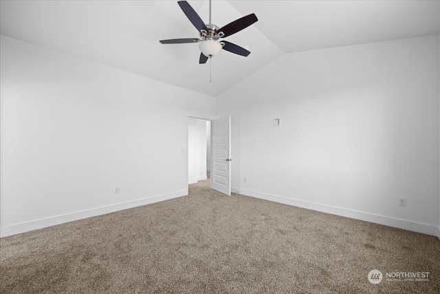 carpeted empty room with ceiling fan and lofted ceiling