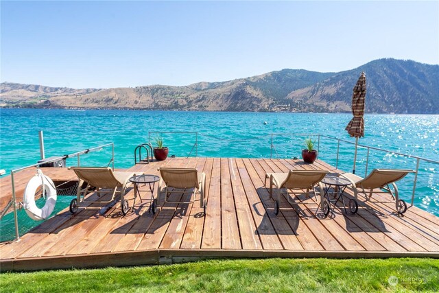 dock area with a water and mountain view