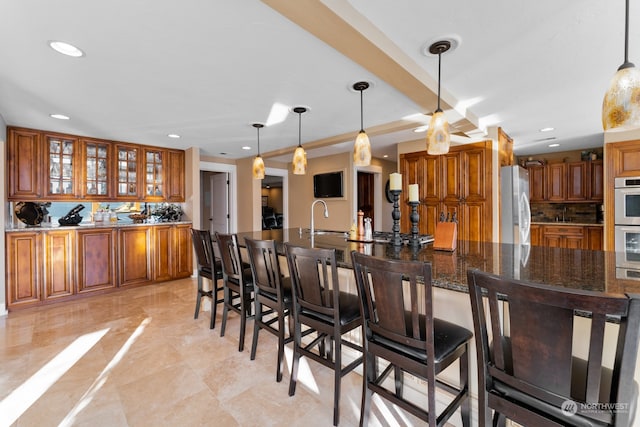 dining area with sink and light tile patterned floors