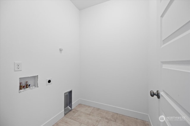 clothes washing area with light tile patterned floors, hookup for an electric dryer, and washer hookup