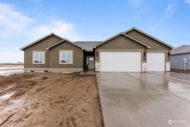 ranch-style house featuring a garage