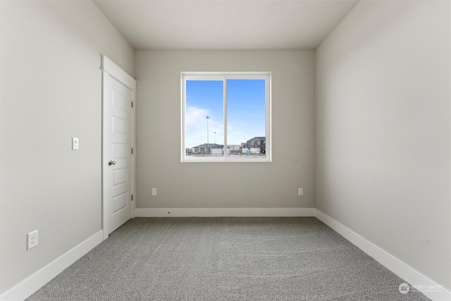 unfurnished room with carpet flooring