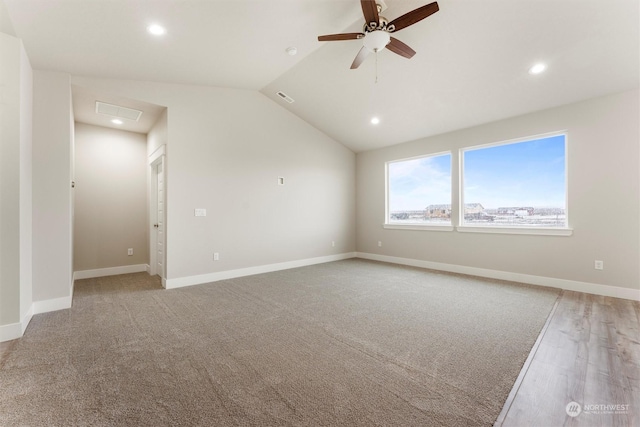 empty room featuring ceiling fan and lofted ceiling