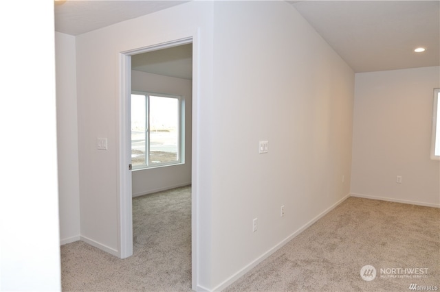 hall with baseboards, carpet flooring, and recessed lighting