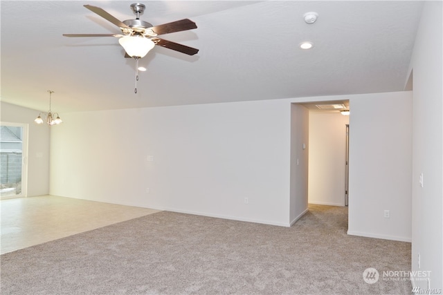 carpeted spare room with ceiling fan