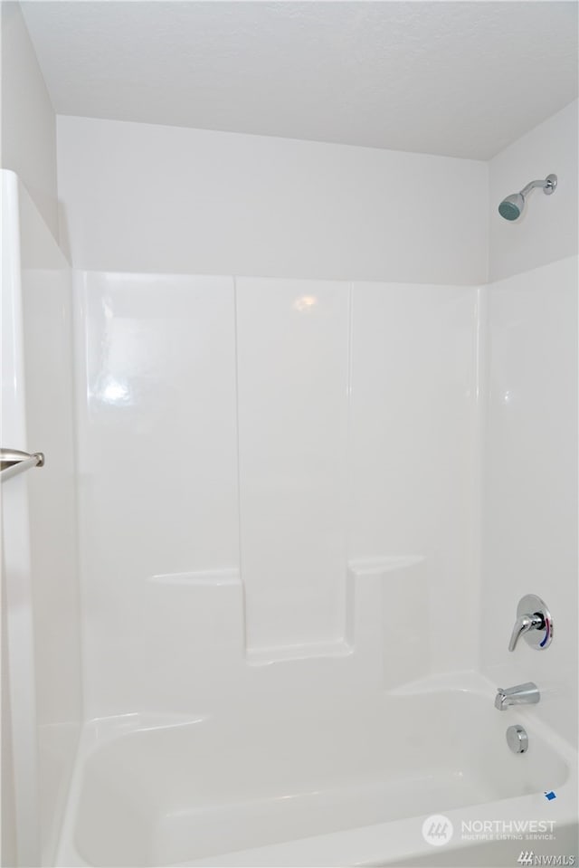 bathroom with shower / bathtub combination