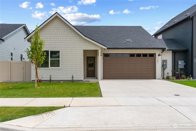 view of front facade with a front yard and a garage