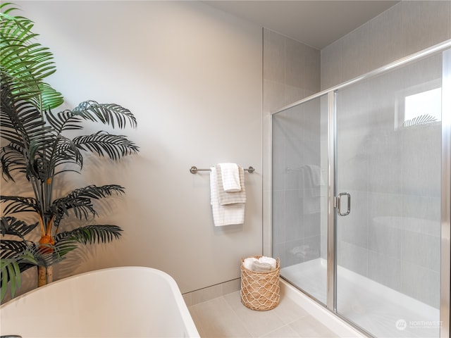 bathroom featuring independent shower and bath and tile patterned flooring