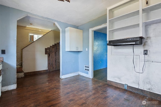 interior space with dark hardwood / wood-style floors