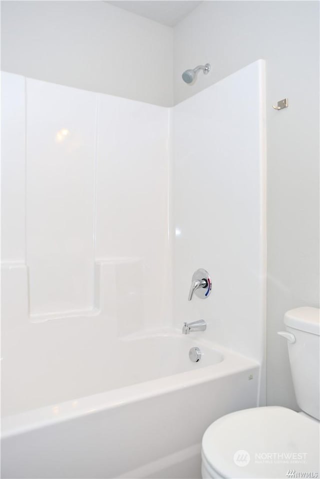 full bathroom featuring shower / tub combination and toilet