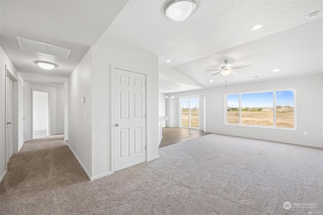 interior space featuring carpet, attic access, baseboards, and recessed lighting