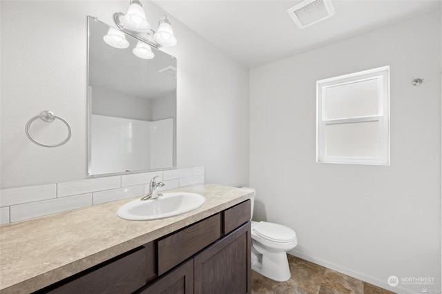 full bathroom featuring toilet, vanity, visible vents, and a notable chandelier