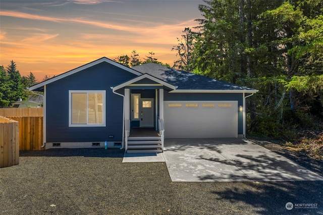 view of front of property with a garage