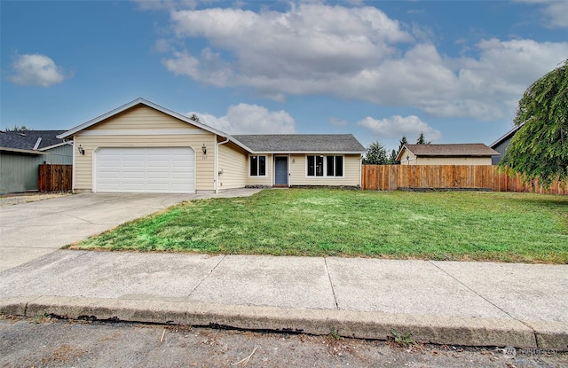 ranch-style home with a garage and a front yard