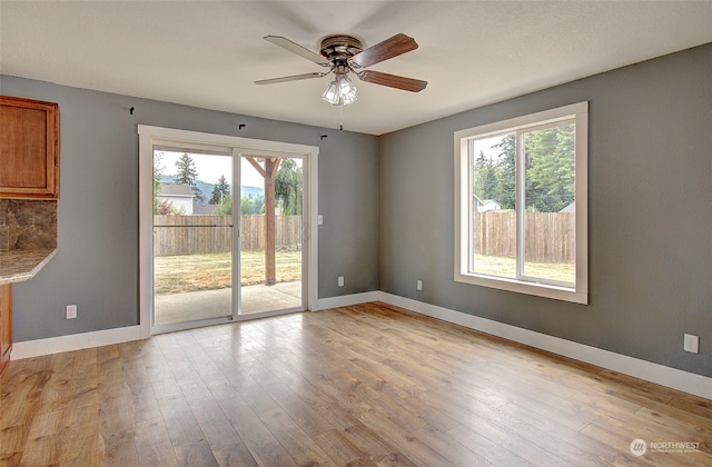 interior space with light hardwood / wood-style floors and ceiling fan