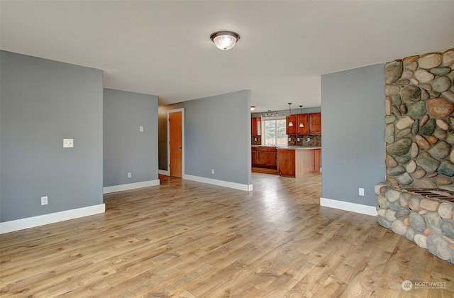 unfurnished living room featuring light hardwood / wood-style floors