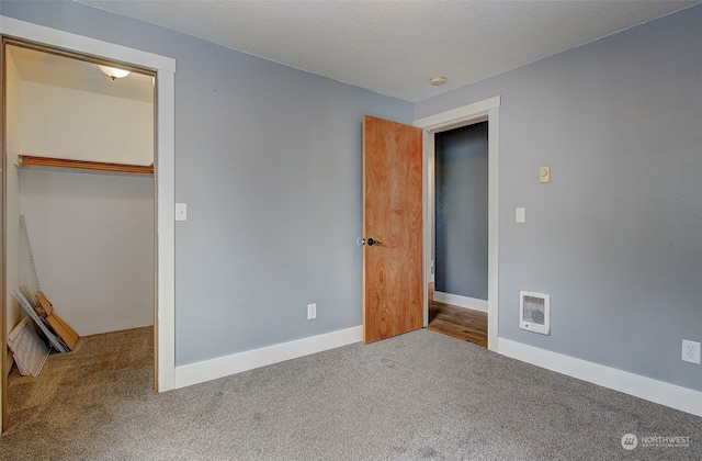 unfurnished bedroom featuring a closet and carpet