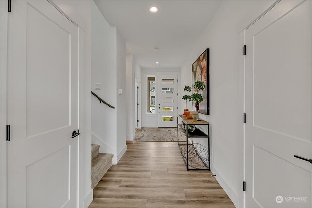 hall with light hardwood / wood-style floors