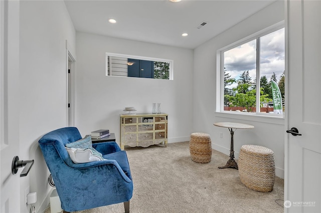 sitting room with carpet floors, recessed lighting, visible vents, and baseboards