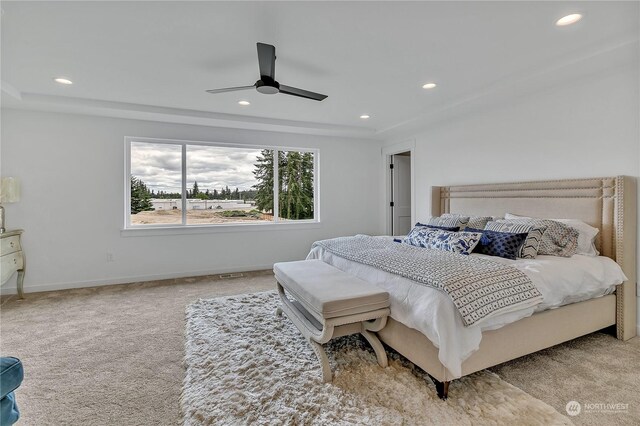 bedroom with ceiling fan and light carpet