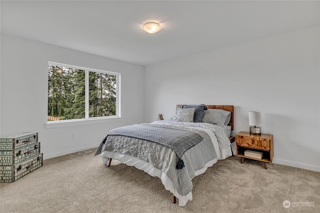 bedroom featuring carpet, visible vents, and baseboards