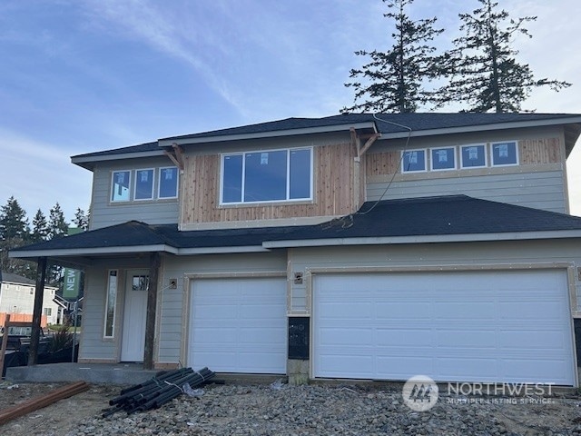 view of front of property featuring a garage