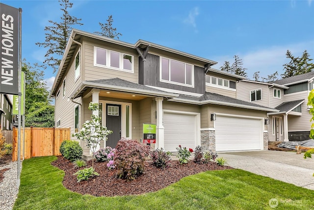 16224 76th Avenue Ct E, Puyallup, WA 98375 - view of front of property featuring an attached garage, driveway, and stone siding