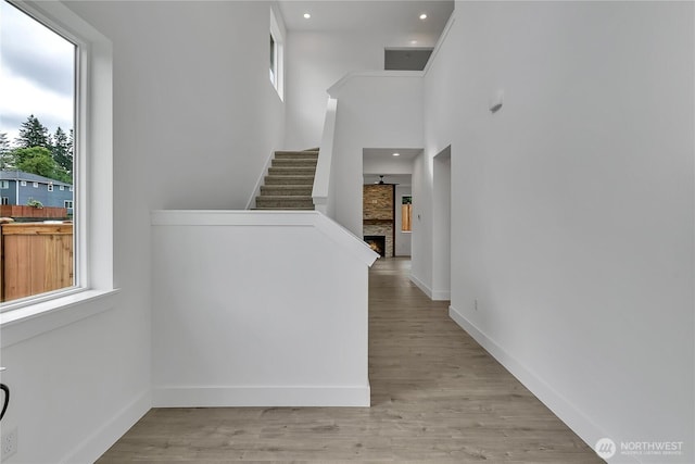 16224 76th Avenue Ct E, Puyallup, WA 98375 - corridor with plenty of natural light, baseboards, light wood-type flooring, and recessed lighting