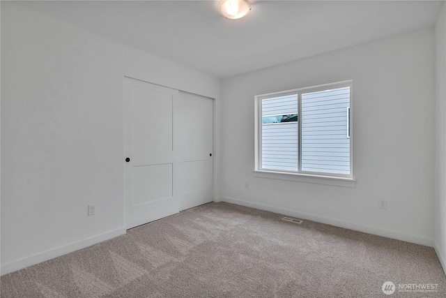 16224 76th Avenue Ct E, Puyallup, WA 98375 - unfurnished bedroom featuring carpet flooring, a closet, and baseboards