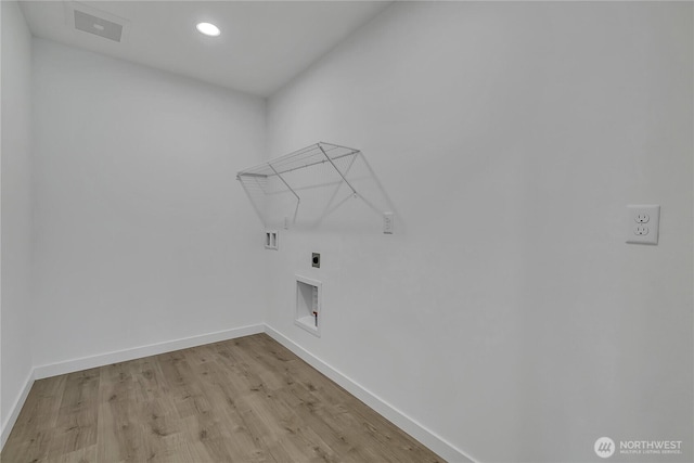 16224 76th Avenue Ct E, Puyallup, WA 98375 - laundry room featuring hookup for an electric dryer, baseboards, light wood-type flooring, recessed lighting, and washer hookup