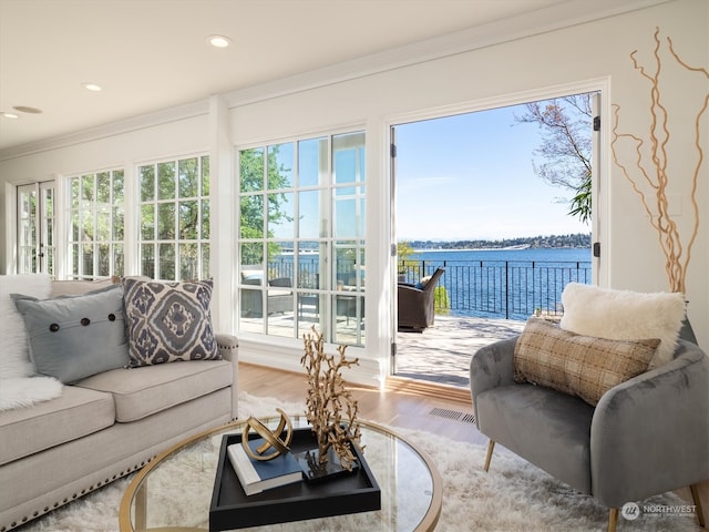 sunroom with a water view