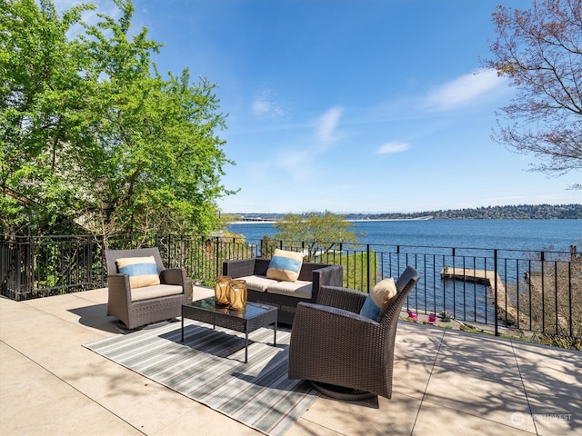 view of patio featuring a water view and an outdoor hangout area