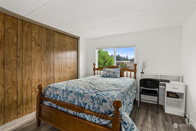 bedroom featuring dark wood-type flooring