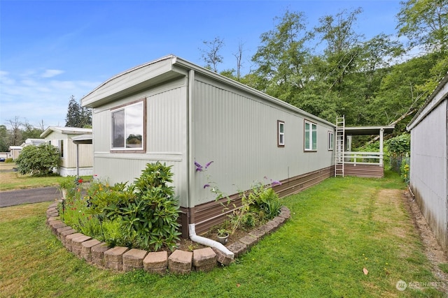 view of home's exterior featuring a yard