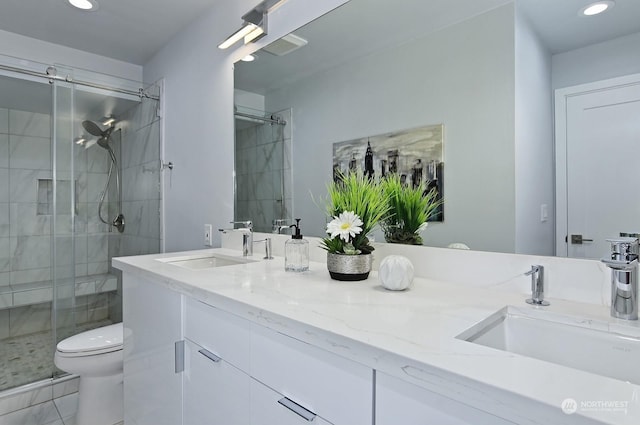 bathroom featuring vanity, an enclosed shower, tile patterned flooring, and toilet