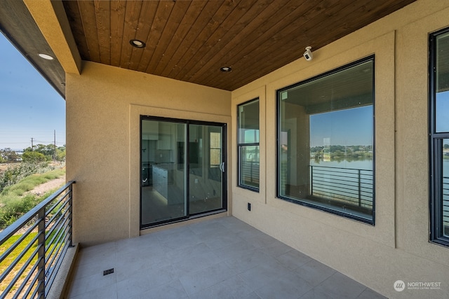 balcony featuring a water view