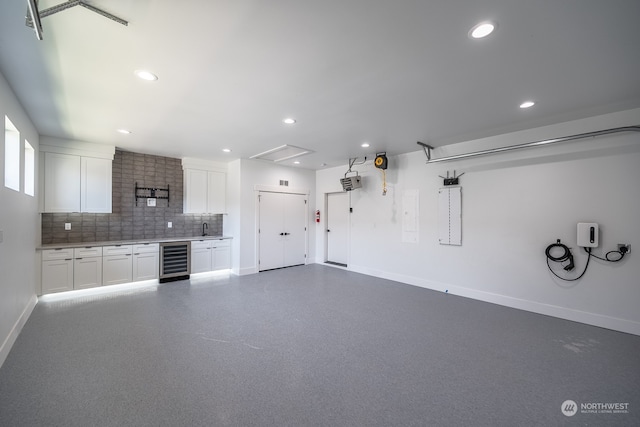 garage with beverage cooler and sink