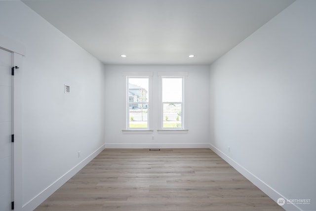 unfurnished room featuring light hardwood / wood-style floors