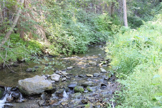 view of landscape with a water view