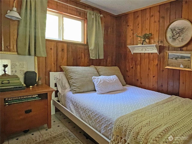 bedroom featuring wood walls