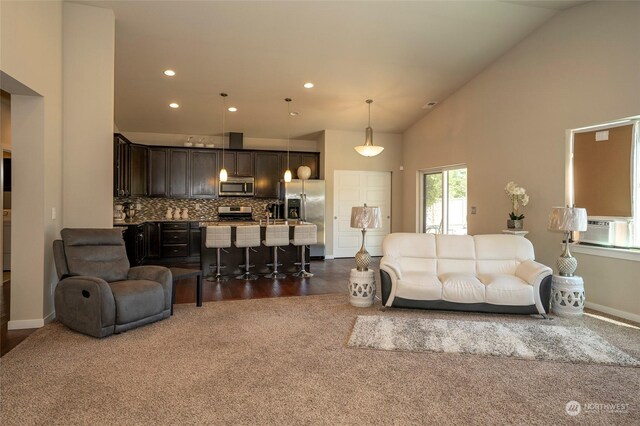 living room with dark hardwood / wood-style flooring, high vaulted ceiling, and cooling unit