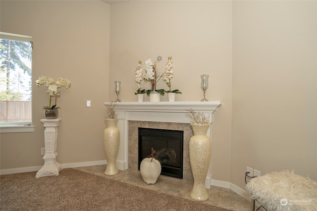 living room with a fireplace and carpet flooring