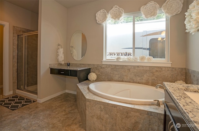 bathroom with separate shower and tub, tile patterned floors, and vanity