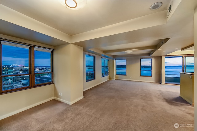 interior space with carpet floors and a water view