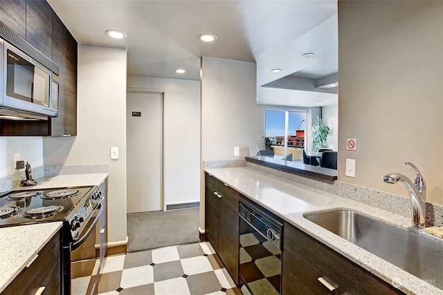 kitchen featuring dark brown cabinets, light carpet, range with electric stovetop, dishwasher, and sink