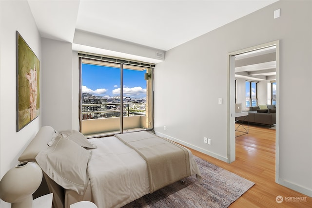 bedroom with light hardwood / wood-style flooring