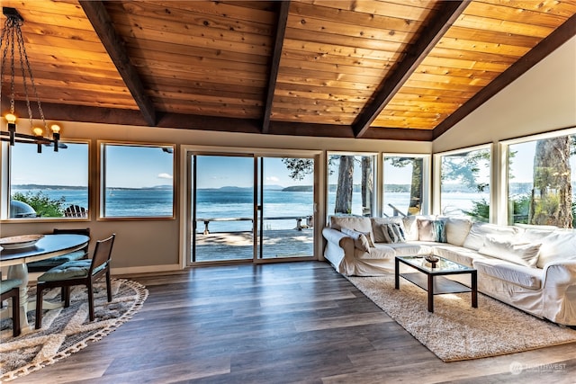 sunroom / solarium featuring wood ceiling, lofted ceiling with beams, a chandelier, and a water view